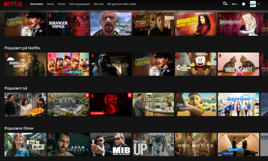 Screengrab from Netflix showing the following titles (N) denotes the red N of Netflix Originals. First row: The Electrical Life of Louis Wain, Stranger Things (N), Breaking Bad, Better Call Saul (N), Brooklyn Nine-Nine, Disenchantment (N). Second row is "Populært på Netflix": The Umbrella Academy (N), Familien Mitchell mot maskinene, The Witcher (N), The Electrical life of Louis Wain, The Cuphead show (N), Hodet på en katt. Third row is "Populært nå": Seinfeld, The Crown (N), Cobra Kai (N), the office, Squid Game (N), Superstore. Forth row is "Populære filmer": Enola Holms (N), The Adam Project (N), Men in Black, Don't Look Up (N), Red Notice (N), Catch me if you can, Mamma Mia!)